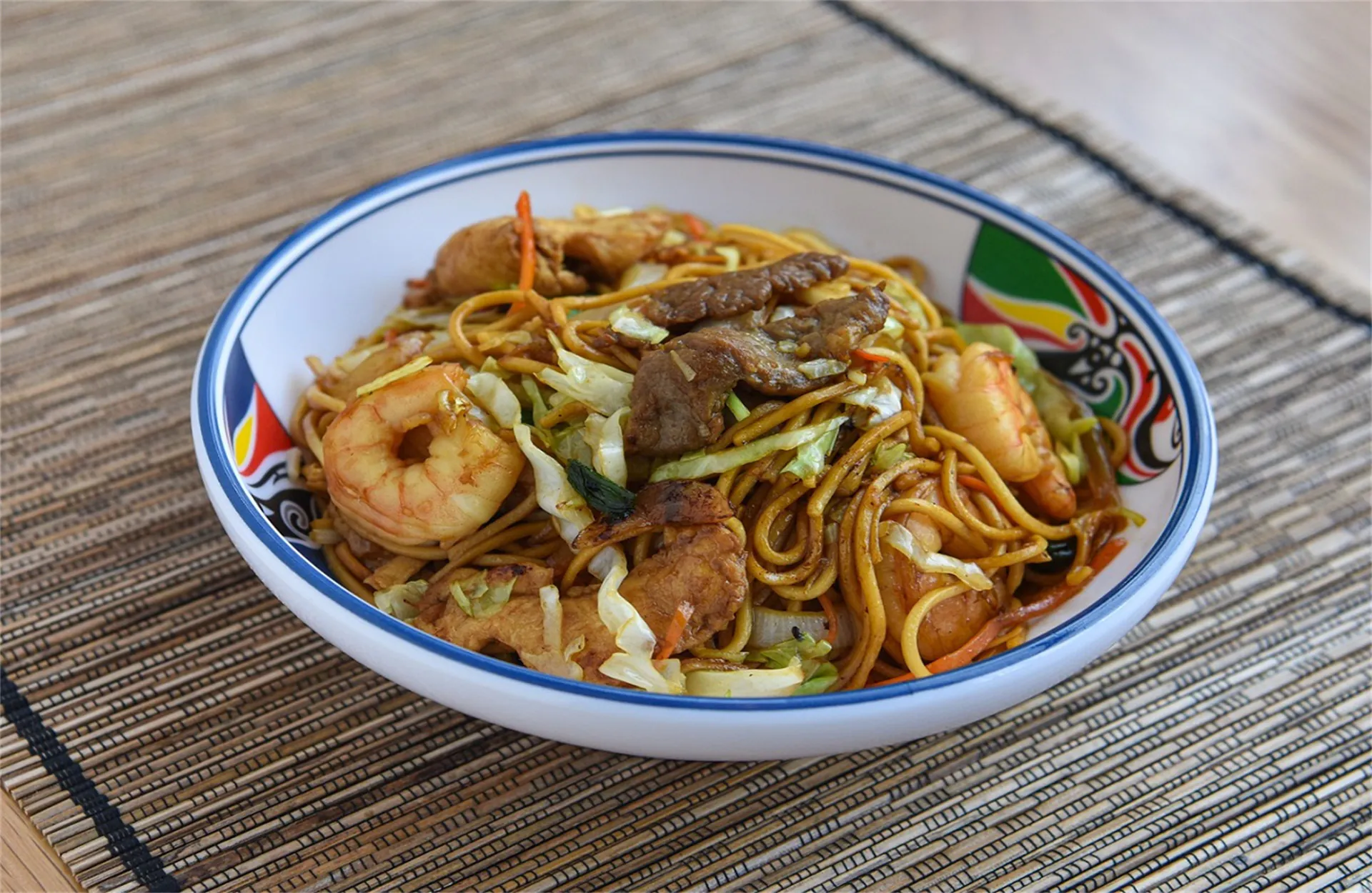 Stir-fried noodles with shrimp, beef, chicken and veggies at Asia Express, a Chinese Restaurant in Philadelphia.